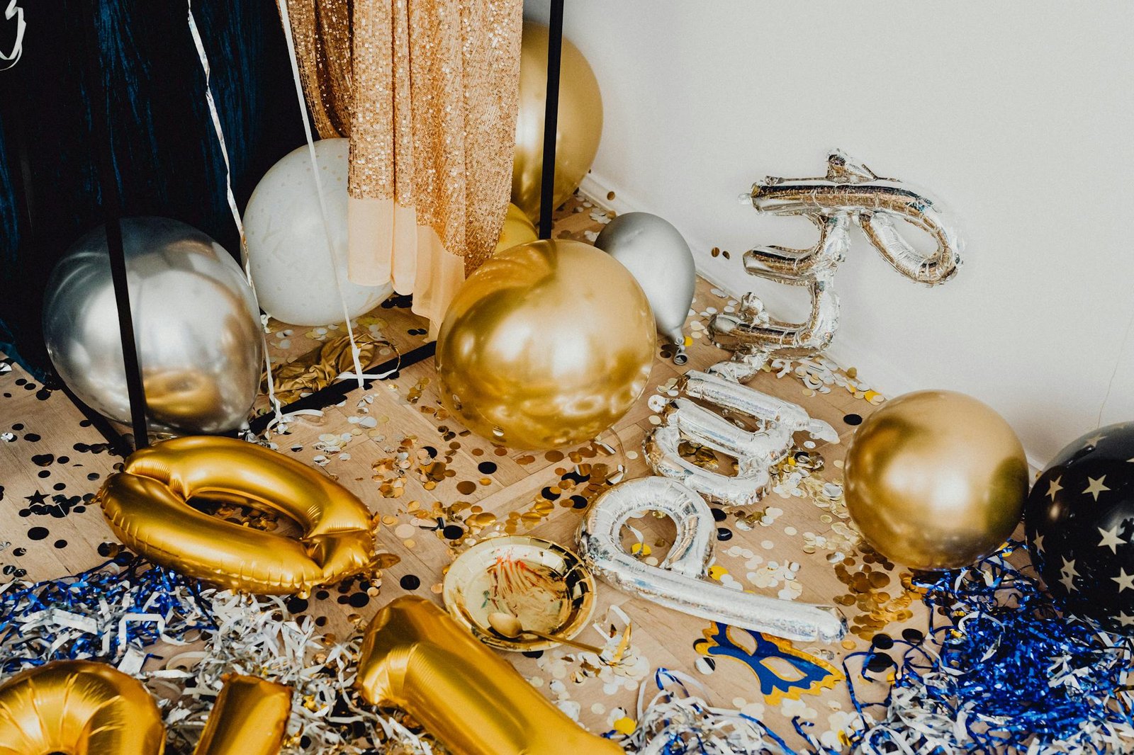 Vibrant indoor party scene with balloons and confetti creating a lively celebration atmosphere.